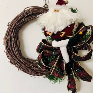 8” grapevine wreath with Santa, ribbon and greenery